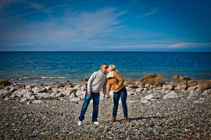 Llandudno beach engagement, kissing by the sea