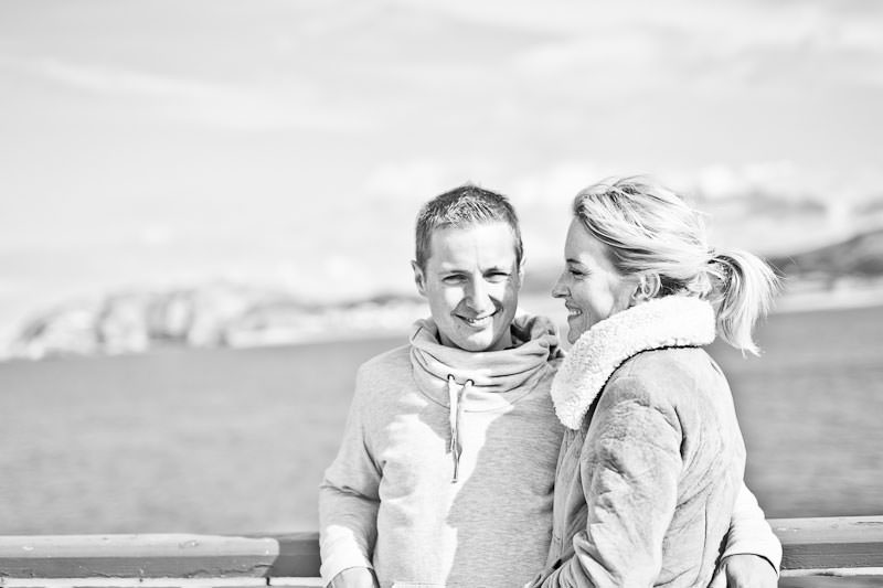 Llandudno pier engagement shoot, black and white relaxing on pier